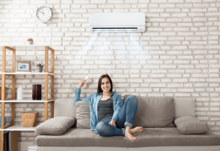 woman next to ductless mini split unit
